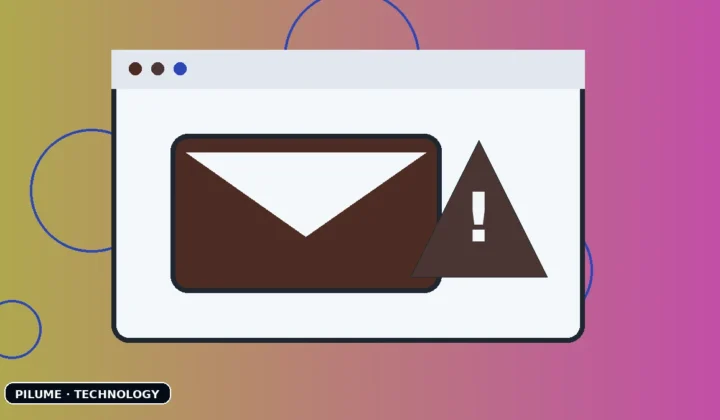 Email inbox on a laptop with a warning symbol highlighting a suspected phishing message